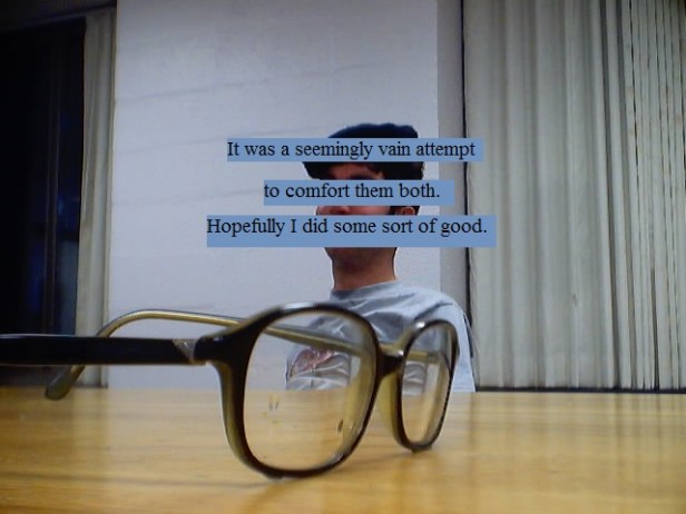 Glasses on a table, a drunk man in the background