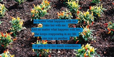 Chili peppers growing in a garden that will soon add to the fire in her belly