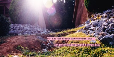 The sun shining on the hill of rocking grass