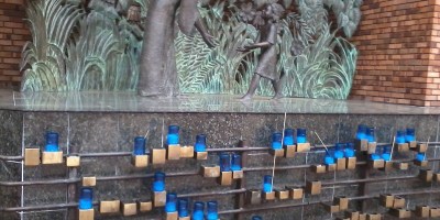 Wall of candles for the dead and sick