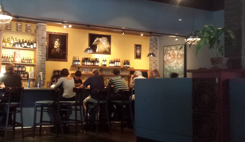 People seated at a bar in a restaurant