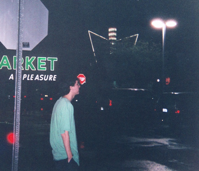 Young man in a parking lot