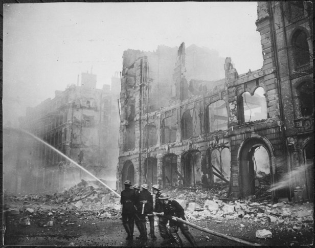 Firemen at work in London after bombing raid 1941