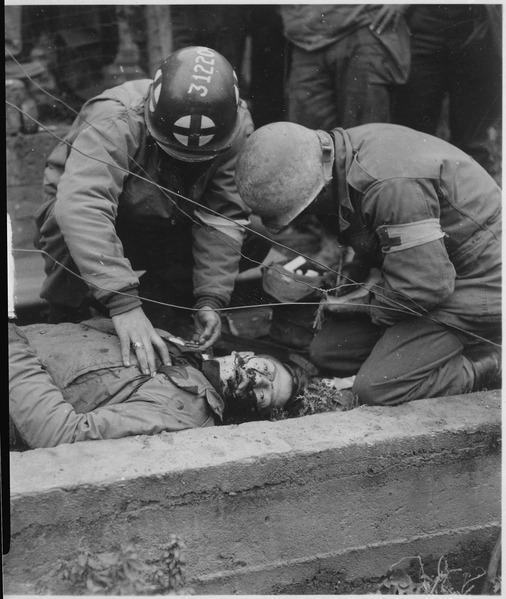 Army medics over a dying American soldier