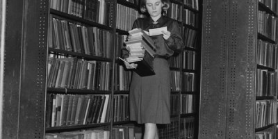 Collecting_books_for_readers_in_the_reserve_stacks,_1964_(3925726691)