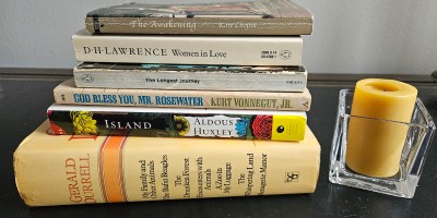 Stack of books with candle